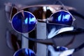 Collection of sunglasses on big reflection mirror Royalty Free Stock Photo