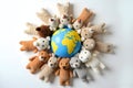 Teddy Bears Surrounding Earth Globe on White Background Royalty Free Stock Photo