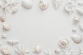 A collection of tiny sea shells, a conch, and sea snails on a clear background, featuring ocean, summer, and vacation Royalty Free Stock Photo