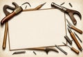 a collection of tools including a carpentering tools and a sign that empty on the middle Royalty Free Stock Photo