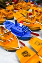 A collection of traditional boat toys in a merchandise booth at a festival in Bandung City, West Java.