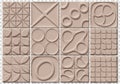 Collection of twelve beige tiles with various embossed geometric patterns Royalty Free Stock Photo