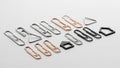 A collection of uniquely shaped paper clips arranged on a white surface Royalty Free Stock Photo