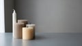 A collection of unlit candles placed on a flat surface against a gray background Royalty Free Stock Photo