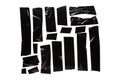 A collection of used black electrical tape pieces  on white background. Royalty Free Stock Photo