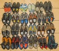 A collection of used mountaineering, approach and climbing shoes. View from above