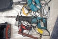 Collection of used power tools, DIY repair equipment.