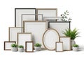 A collection of various empty picture frames and potted plants on a white background Royalty Free Stock Photo