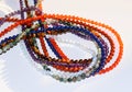 Collection of various mineral beads on thread Royalty Free Stock Photo