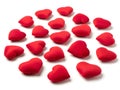 Assorted red heart-shaped objects scattered on a white background Royalty Free Stock Photo