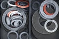 Collection of various rubber washers organized in a divided storage container Royalty Free Stock Photo