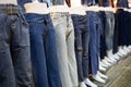 Collection of various types of blue jeans trousers, row of female mannequin in legs of womenÃ¢â¬â¢s jeans of different colors, Royalty Free Stock Photo