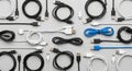 A collection of various USB cables arranged on a grey surface Royalty Free Stock Photo