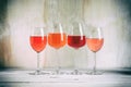 Collection various wines in glasses on a white wooden table. Wine tasting concept. Toned, rustic style. Copy space