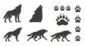 Wolf Silhouettes and Paw Prints Set on White Background Royalty Free Stock Photo