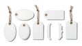 Collection of variously shaped blank paper tags with jute strings Royalty Free Stock Photo