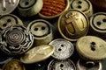 Collection of vintage clothing buttons. Dark stone background, grunge photo. Royalty Free Stock Photo