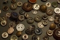 Collection of vintage clothing buttons. Dark stone background, grunge photo. Royalty Free Stock Photo