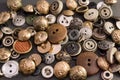 Collection of vintage clothing buttons. Dark stone background, grunge photo.