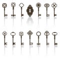 Collection of vintage keys and keyhole with long shadows.