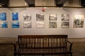 Collection of vintage photos on a tiled wall of the New York subway