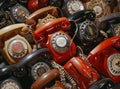 Collection of vintage rotary dial telephones in various colors and conditions. Royalty Free Stock Photo