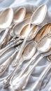 Collection of vintage silver spoons with intricate patterns on fabric, AI Generative Royalty Free Stock Photo