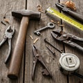 A collection of vintage tools is arranged on a rustic wooden Royalty Free Stock Photo