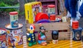 Collection of vintage toys and tins, including bisto, elastoplast and cola cao on stall at Frome Sunday Market, Somerset, UK Royalty Free Stock Photo