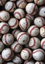 Collection of weathered baseballs displaying dirt and wear, ready for a new game. Royalty Free Stock Photo