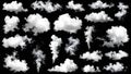 Collection of white fluffy clouds isolated on a black background for design elements. Royalty Free Stock Photo