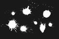 Various white paint splatters on a dark background showcasing an artistic display of creativity and chaos Royalty Free Stock Photo