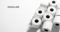Collection of white paper rolls on a clean surface Royalty Free Stock Photo