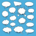 A collection of white speech bubbles on a blue background Royalty Free Stock Photo