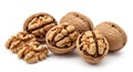 A collection of whole and cracked walnuts revealing their textured brown shells and light brown kernels Royalty Free Stock Photo