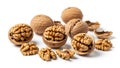 Assortment of whole and shelled walnuts with scattered shells on a white background Keywords: walnuts, nuts, whole Royalty Free Stock Photo