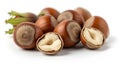 Pile of Whole and Halved Hazelnuts with Green Husks Showing on a White Background Keywords: hazelnuts, nuts, whole Royalty Free Stock Photo