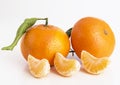 Collection of whole tangerine or clementine fruits and peeled segments
