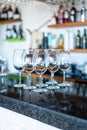 Collection of wine glasses on a bar Royalty Free Stock Photo