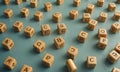 collection wooden cubes, each containing letter the alphabet, arranged in grid-like pattern on blue