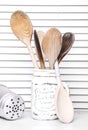 Collection of wooden spoons in a retro container Royalty Free Stock Photo