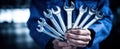 The collection of wrenches held by a mechanic in a workshop environment..AI generated image Royalty Free Stock Photo