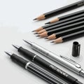 Collection of Writing Instruments - Pencils and Pens on White Background Royalty Free Stock Photo