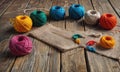 A collection of yarn balls in various colors are laid out on a wooden table. Royalty Free Stock Photo
