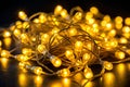 Holiday and Christmas lights (Many yellow LED fairy string lights create light and shadow on clear black background Royalty Free Stock Photo