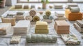 A collection of yoga props such as blocks ss and bolsters are neatly displayed on a white mat. This image promotes the