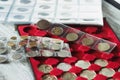 Collector`s coins in the box for coins and page with pockets