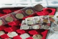 Collector`s coins in the box for coins and page with pockets