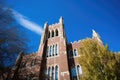 college building towering against a clear blue sky