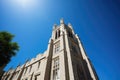 college building towering against a clear blue sky